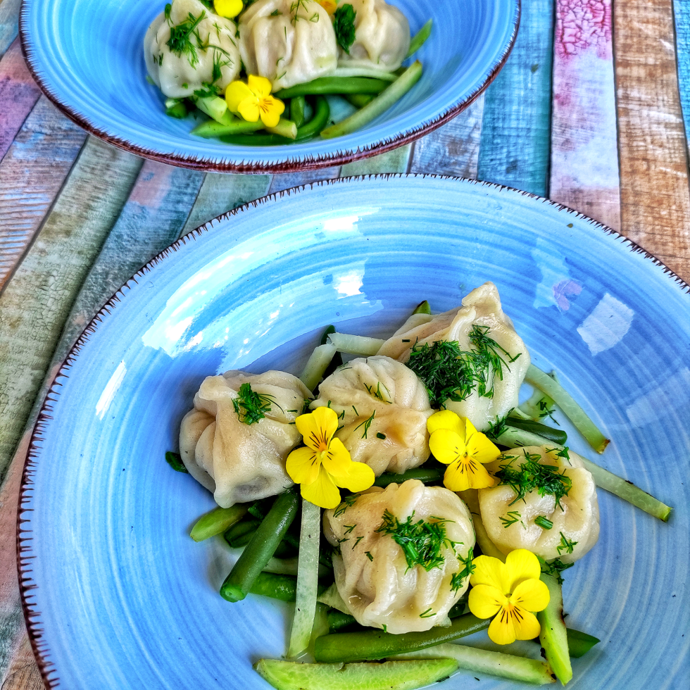 Dumplings with Grikios salad cheese and pistachios